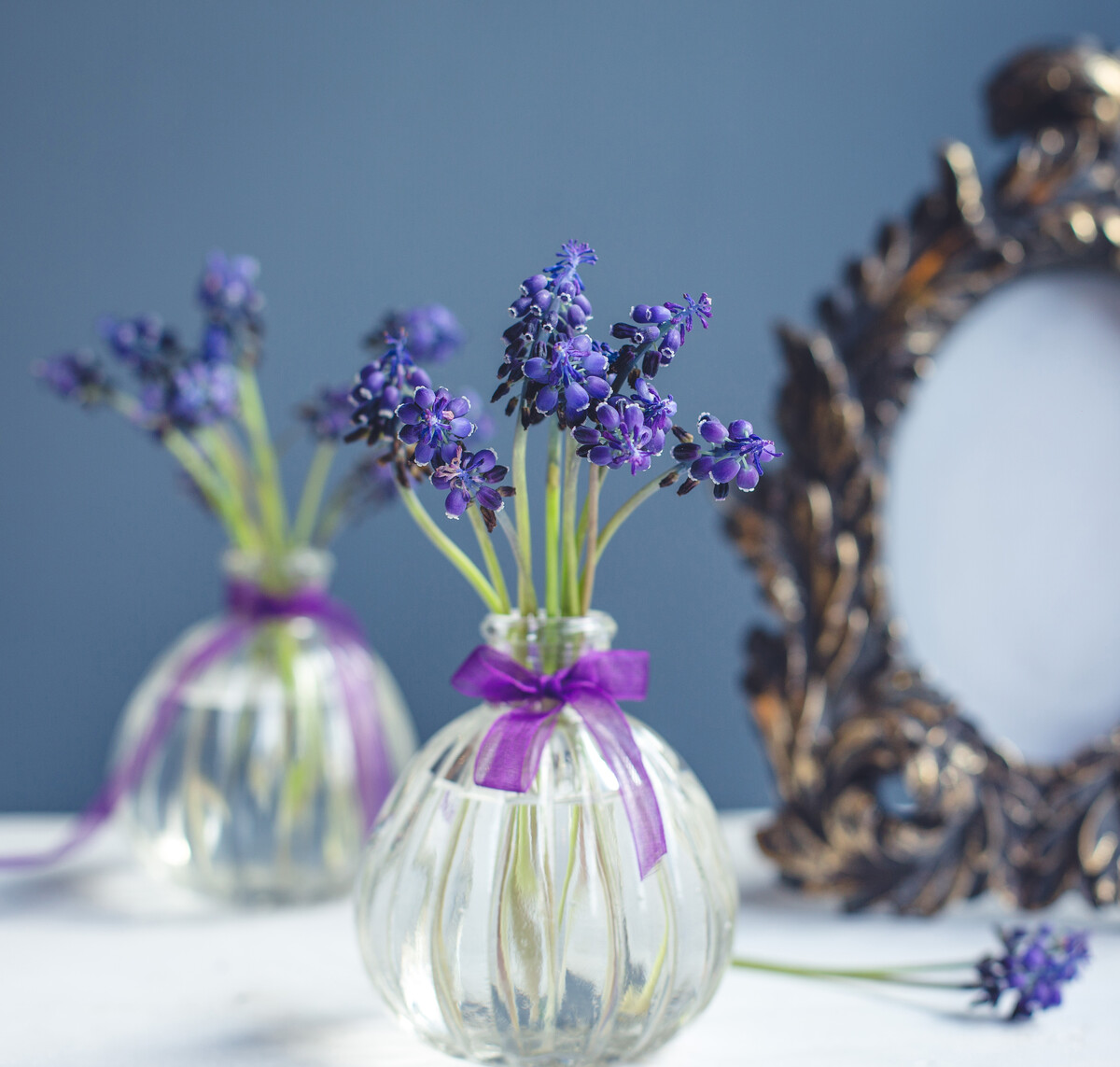 lavander branches inside small pretty flask vase
